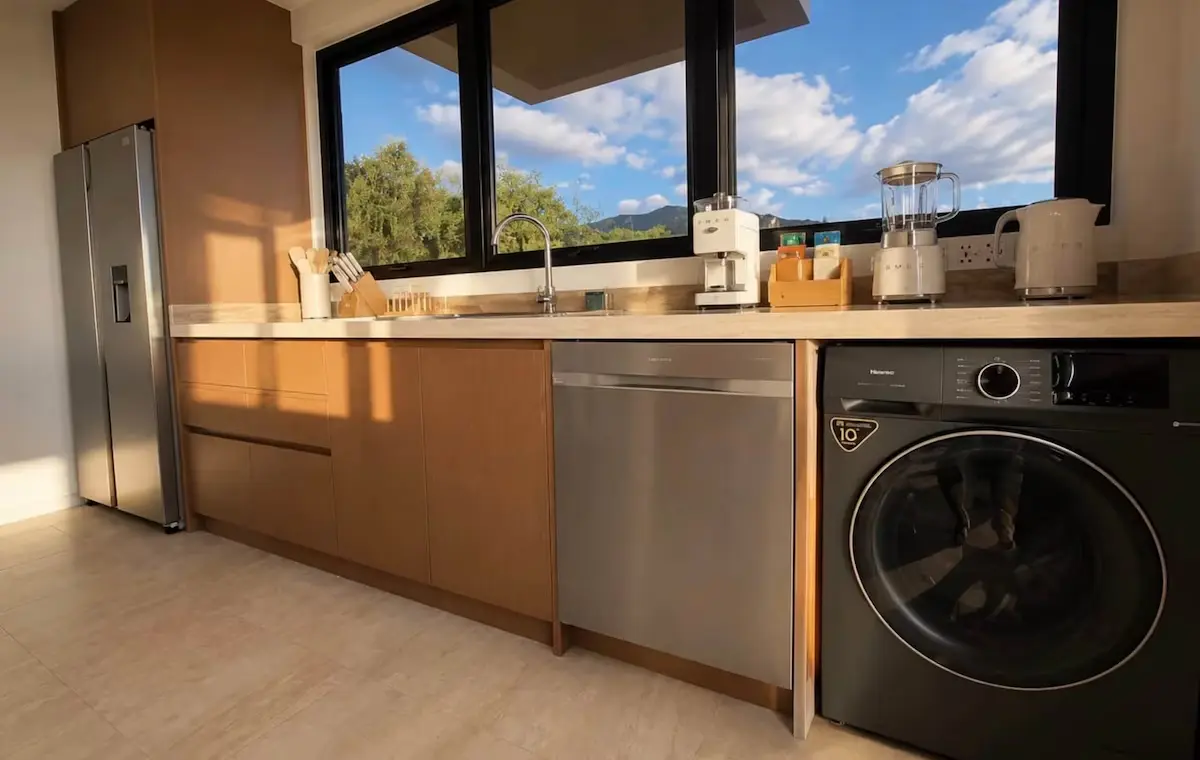Crystal View custom kitchen cabinetry and millwork with integrated appliances and modern countertop in Dominica