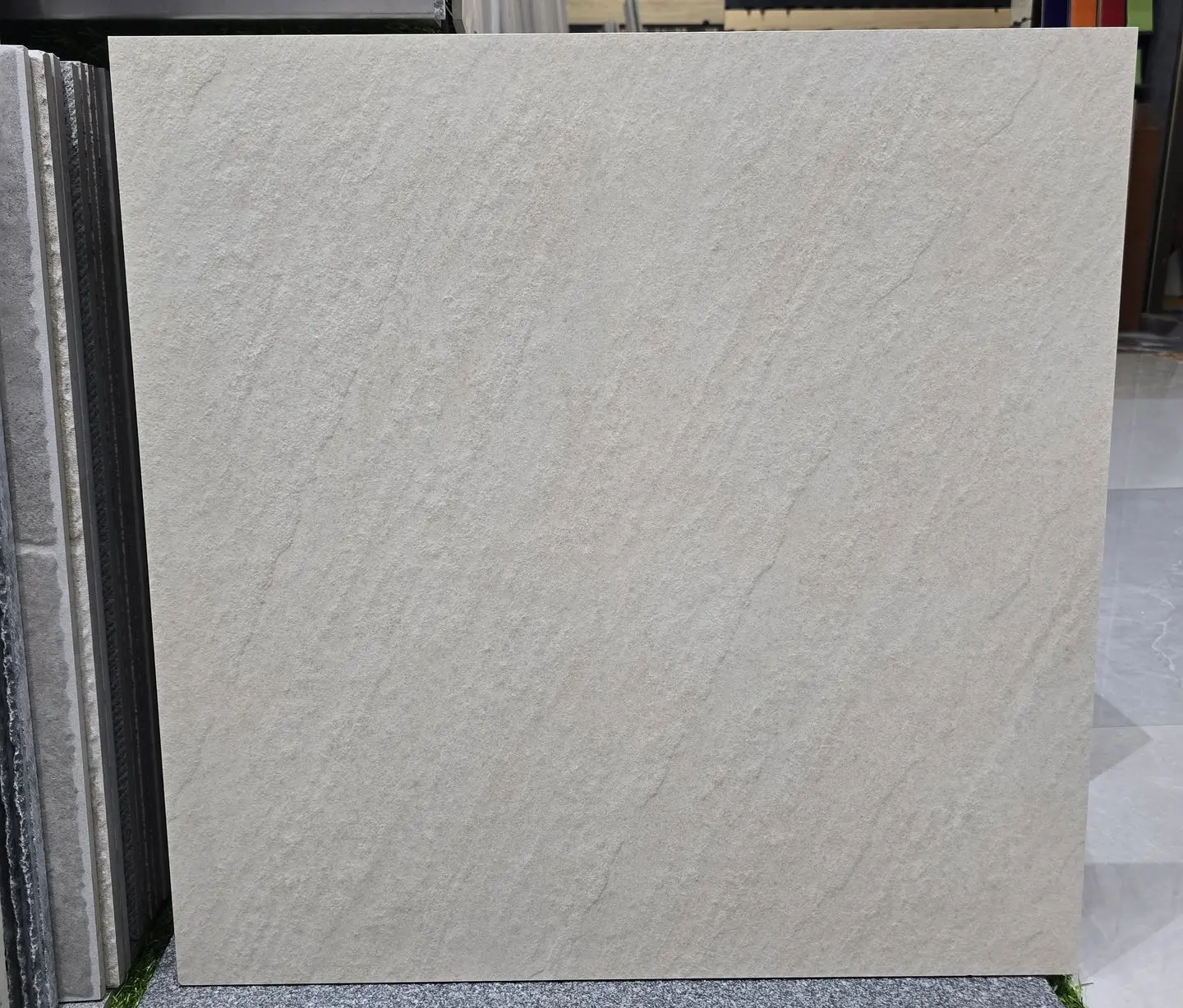 Textured Porcelain Tile Sample for China Sourcing and Quality Inspection Textured porcelain tile sample displayed in a China showroom for sourcing and quality evaluation