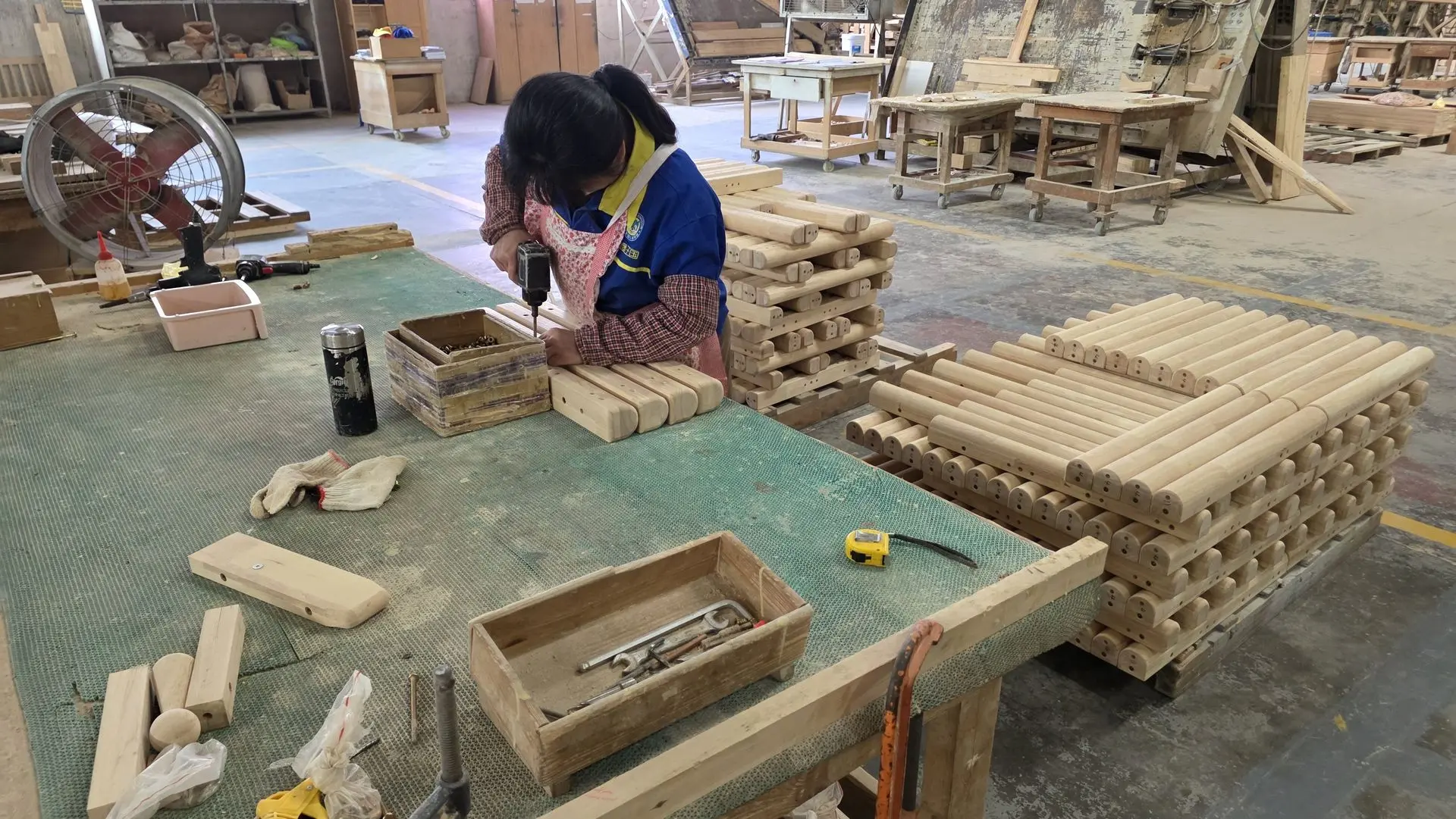 OEM and ODM Decorative Wood Carving Manufacturing Services in China Worker assembling custom decorative wood carving components for OEM and ODM manufacturing services in China