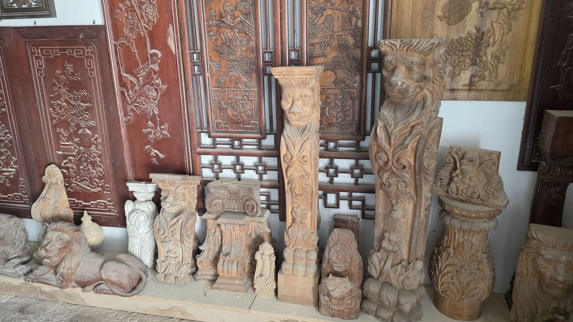 Decorative Wood Carving Columns and Architectural Ornaments Decorative wood carving columns, corbels, and architectural ornaments displayed in a wood carving showroom