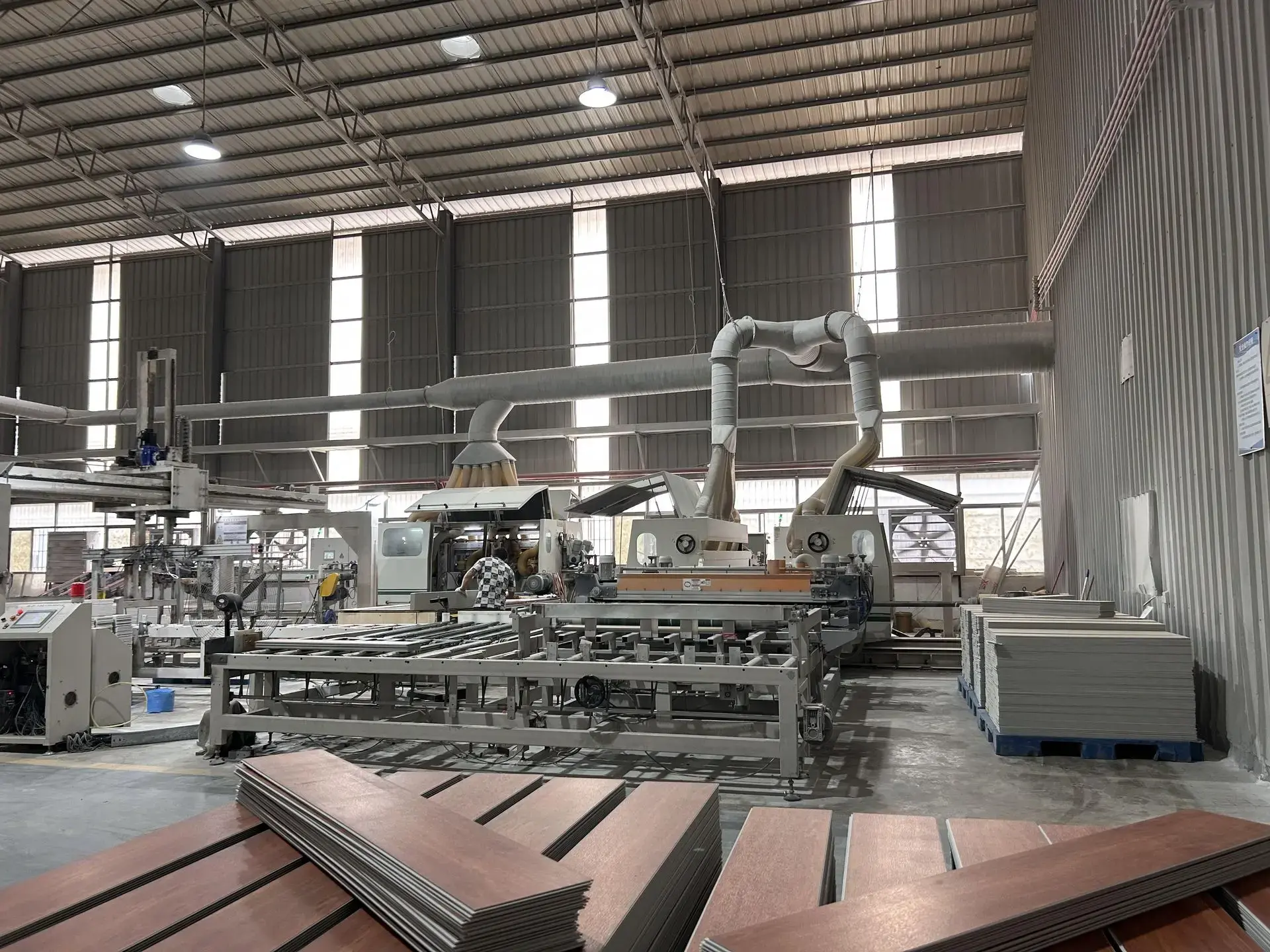 Large-scale factory in China equipped with advanced machinery for furniture and building materials production