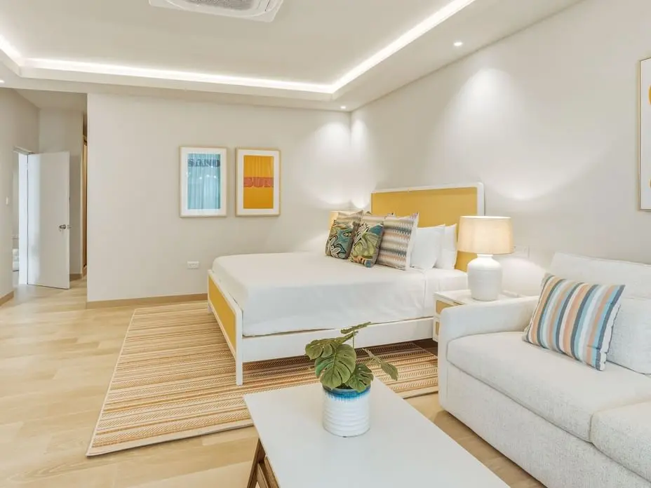 Spacious villa bedroom featuring custom furniture, lighting and modern interior design