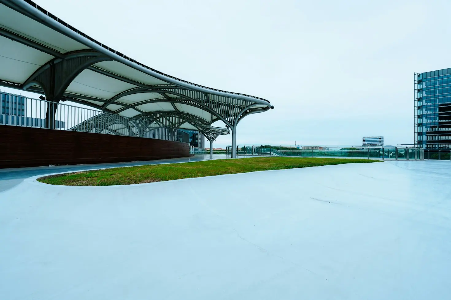 Custom architectural canopy with curved metal frame and roof