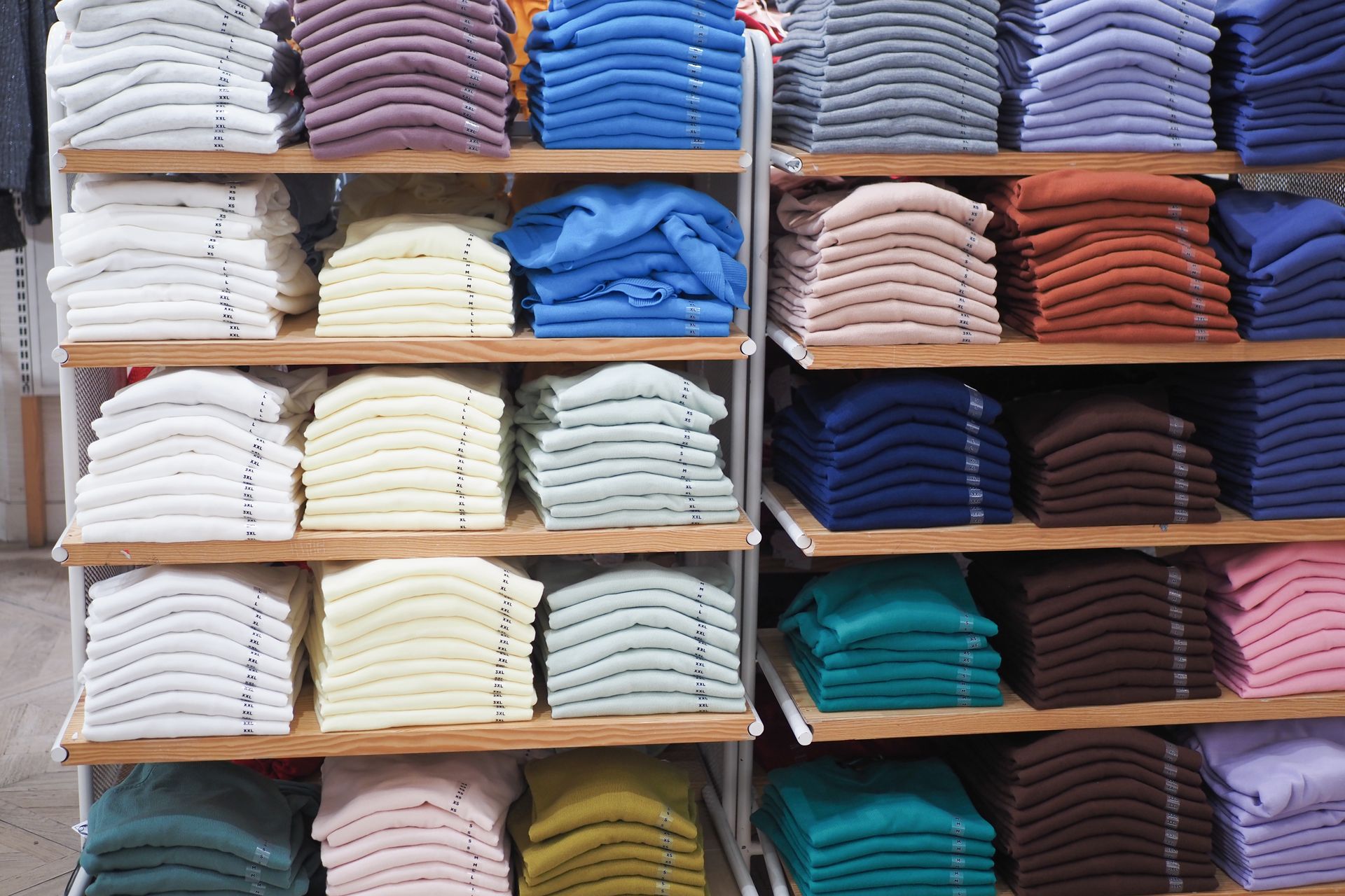 Colorful shirts on shelves